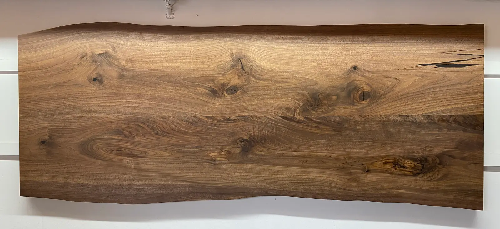 Finished black walnut live-edge slab, 40 by 108 inches