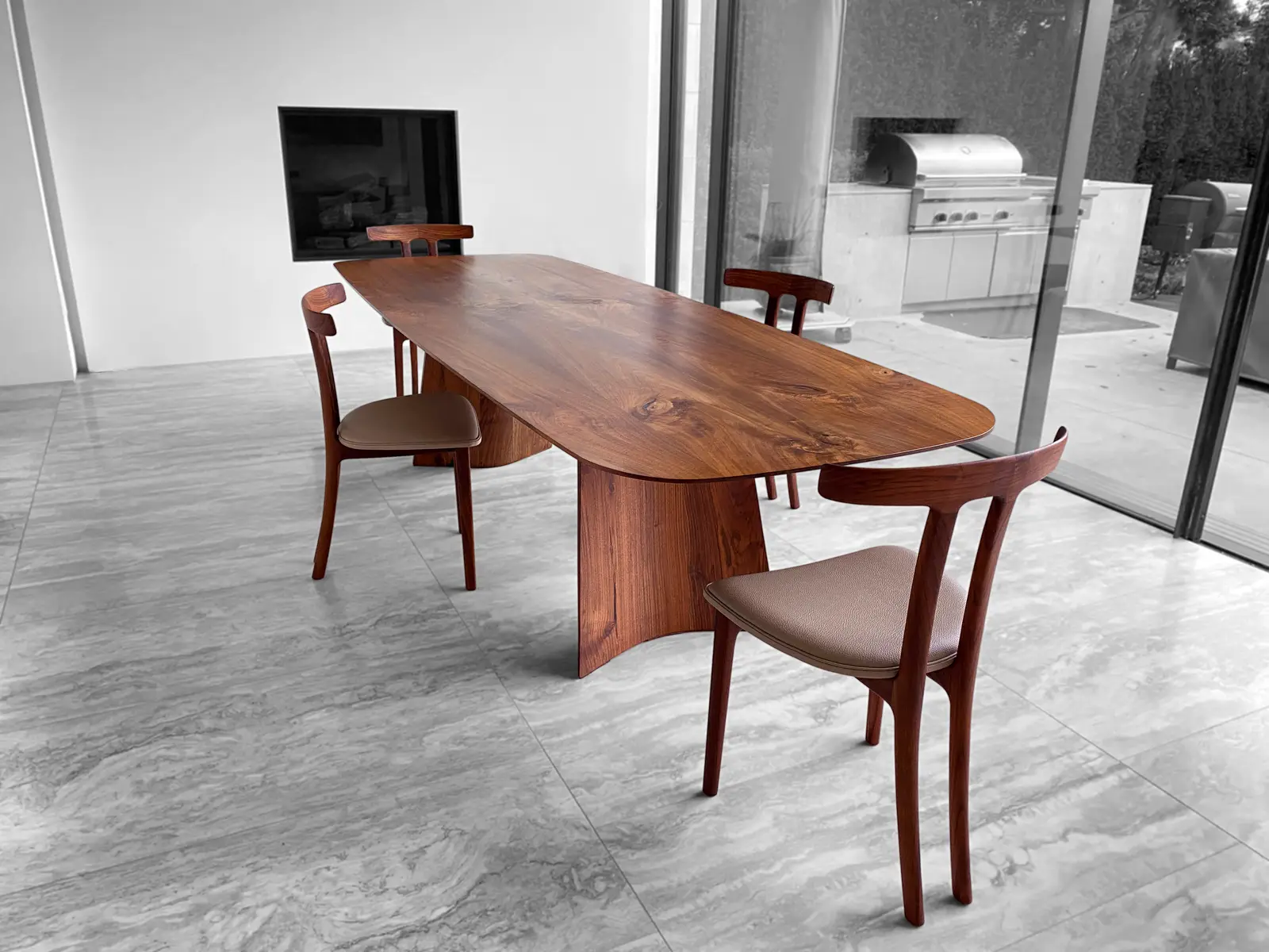Swell dining table with matching sculpted chairs in solid walnut