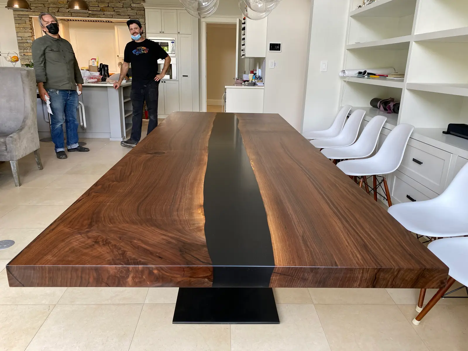 Black walnut river table with a cast black resin channel